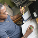 Janoi Burgess studies in his room at his home near Miami.
Liam Crotty for Kaiser Health News